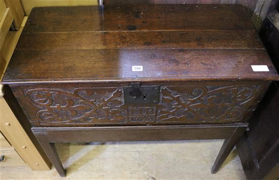 A carved oak bible box on stand